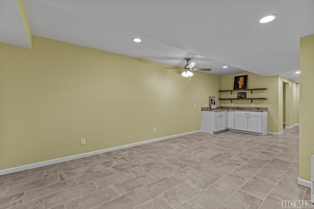 unfurnished living room featuring ceiling fan