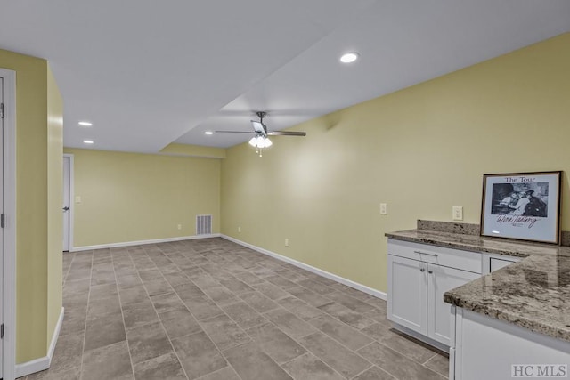 interior space featuring ceiling fan