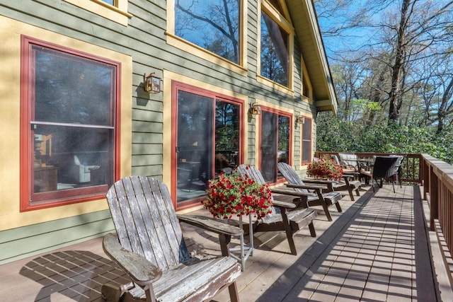 deck featuring outdoor dining area