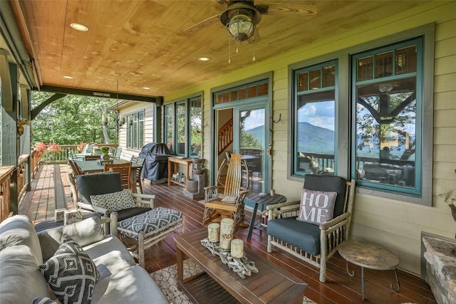 exterior space with area for grilling, an outdoor hangout area, a deck, and ceiling fan