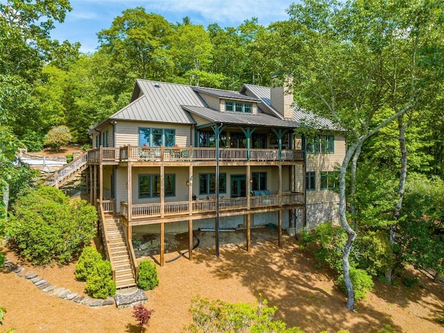 back of house featuring a wooden deck