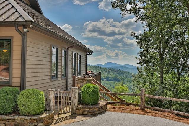 view of side of home with a mountain view