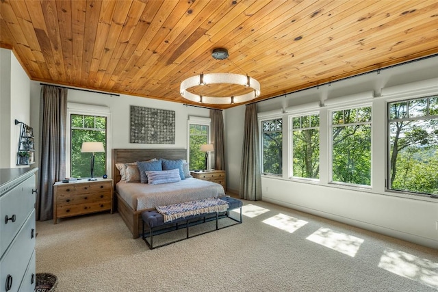 carpeted bedroom with wooden ceiling