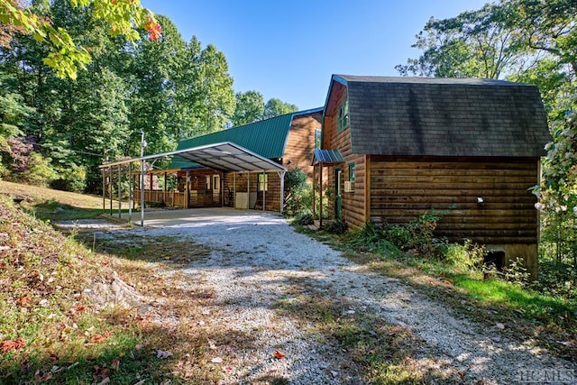 view of side of property featuring a carport