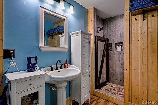 bathroom featuring wood-type flooring and a shower