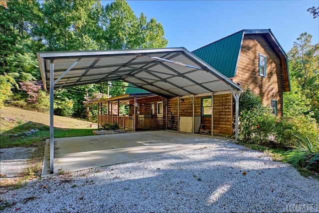 view of parking / parking lot featuring a carport