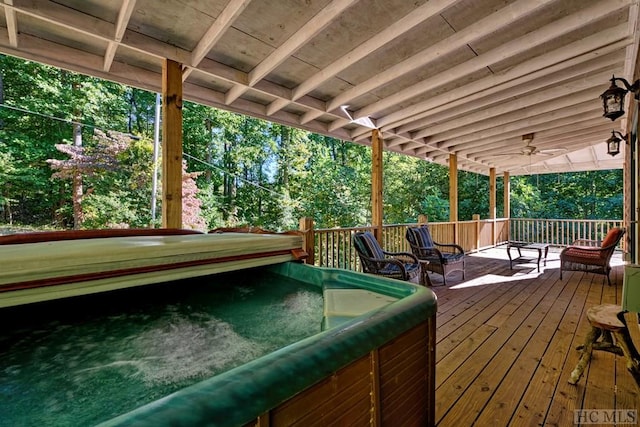 wooden deck featuring ceiling fan