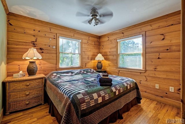 bedroom with light wood-type flooring and ceiling fan