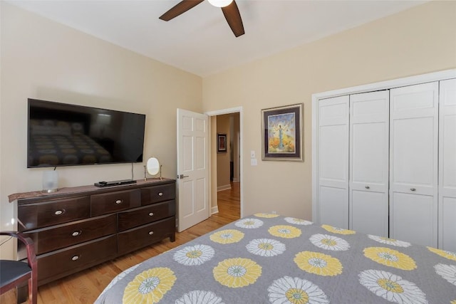 bedroom with a closet, ceiling fan, and wood finished floors