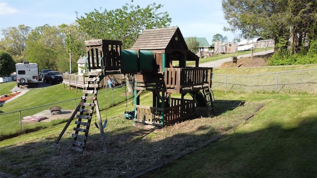 view of play area featuring fence and a yard