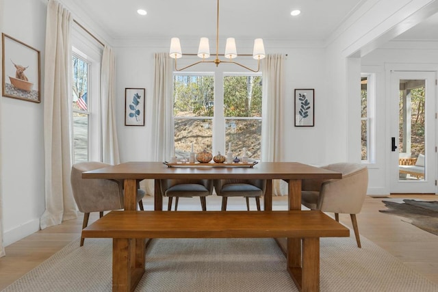 dining room featuring recessed lighting, a chandelier, light wood-style floors, and ornamental molding