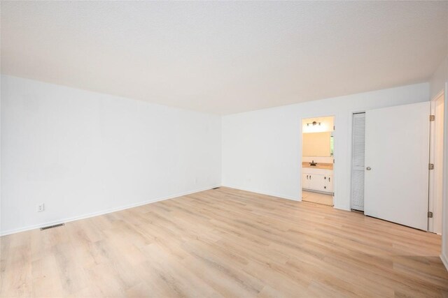 233 Meadow Way Unit 1615, Sapphire, NC 28774 - bonus room with light wood finished floors, baseboards, and a sink