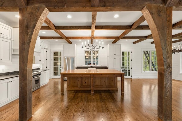 525 High Mountain Dr, Cashiers, NC 28717 - dining space with a chandelier, coffered ceiling, wood finished floors, beamed ceiling, and recessed lighting