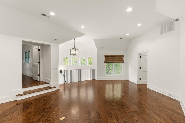 525 High Mountain Dr, Cashiers, NC 28717 - unfurnished living room with a chandelier, baseboards, wood finished floors, recessed lighting, and vaulted ceiling