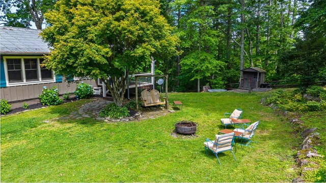 3050 N Hwy 107, Cashiers, NC 28736 - view of grassy yard featuring an outdoor fire pit and a storage shed