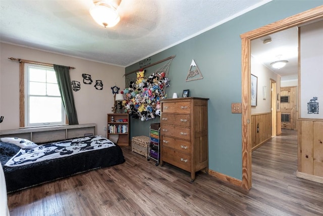 3050 N Hwy 107, Cashiers, NC 28736 - bedroom featuring wood finished floors, a wainscoted wall, ornamental molding, wooden walls, and a ceiling fan