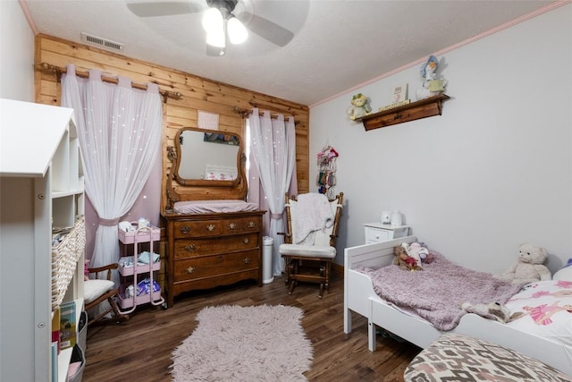 3050 N Hwy 107, Cashiers, NC 28736 - bedroom with ornamental molding, wood finished floors, wooden walls, and a ceiling fan