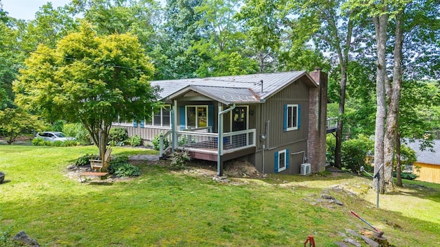 3050 N Hwy 107, Cashiers, NC 28736 - view of front facade with a chimney, a front lawn, a metal roof, and a standing seam roof