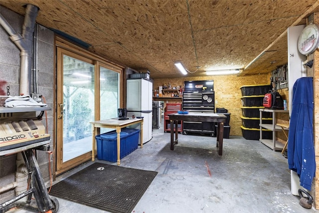 3050 N Hwy 107, Cashiers, NC 28736 - miscellaneous room with unfinished concrete flooring and a workshop area