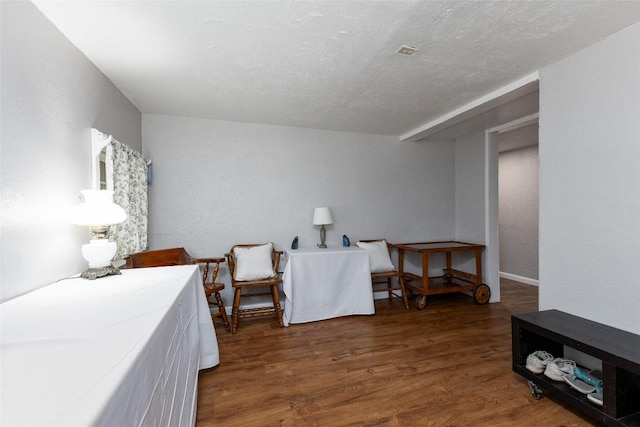 3050 N Hwy 107, Cashiers, NC 28736 - bedroom with wood finished floors and a textured ceiling