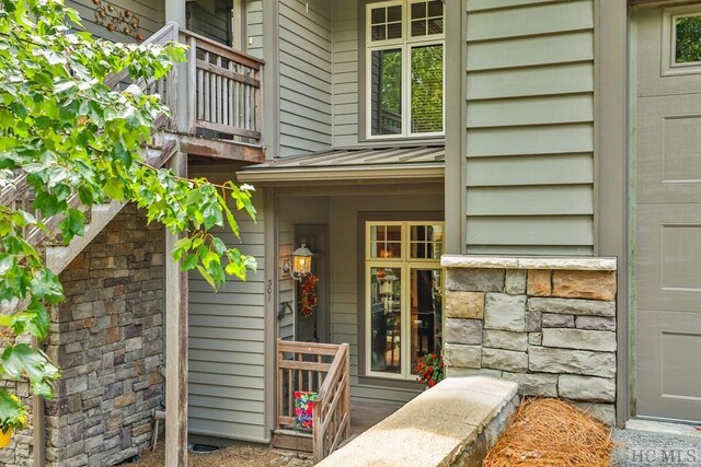 property entrance with a balcony