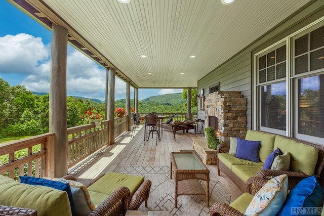 view of patio / terrace featuring a mountain view and an outdoor hangout area