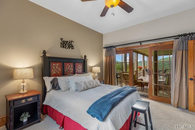 carpeted bedroom with ceiling fan and access to outside