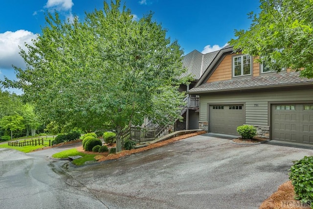 view of side of property featuring a garage