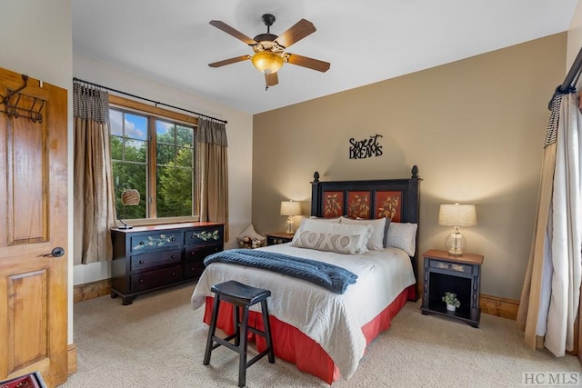 bedroom with ceiling fan and light colored carpet