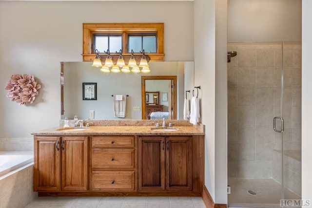 bathroom featuring vanity, shower with separate bathtub, and tile patterned flooring