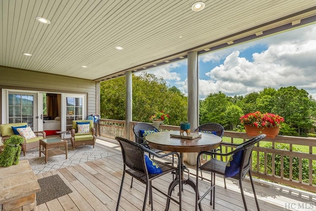 sunroom featuring wood ceiling