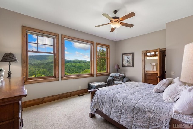 bedroom with ceiling fan and carpet flooring