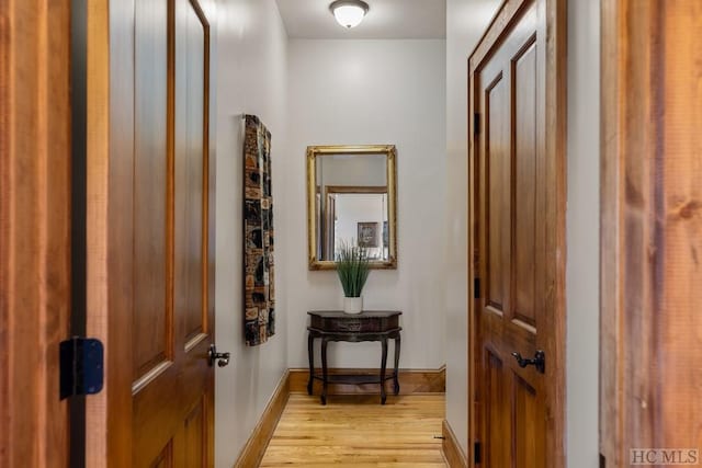 doorway to outside with light wood-type flooring