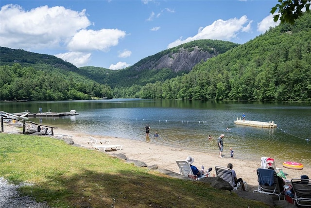 water view featuring a mountain view and a forest view