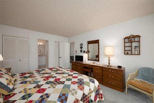 carpeted bedroom with connected bathroom