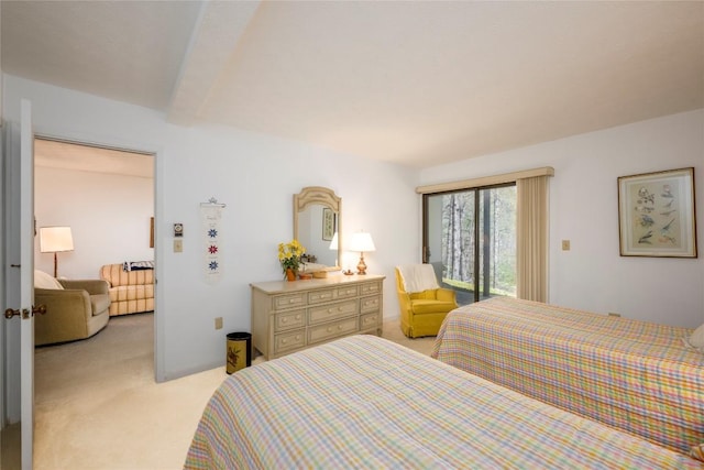 bedroom featuring light colored carpet and access to outside
