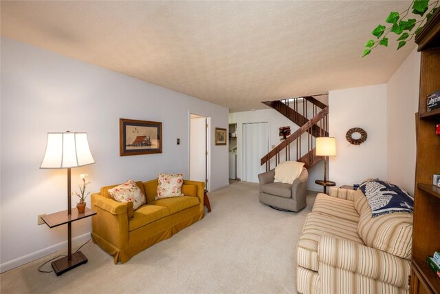 carpeted living area with stairway and a textured ceiling