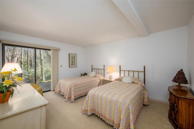 bedroom featuring access to outside, beam ceiling, and light colored carpet