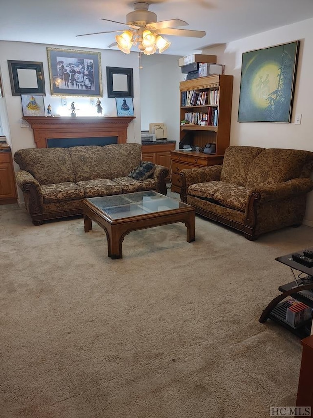 carpeted living room featuring ceiling fan