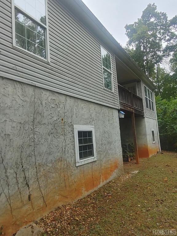 view of side of property featuring a balcony