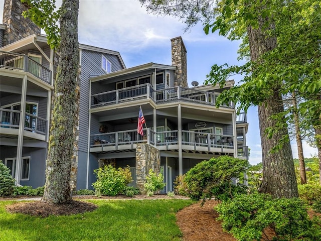 66 Country Club Vlg Unit 66, Lake Toxaway, NC 28747 - rear view of property with a chimney and a balcony