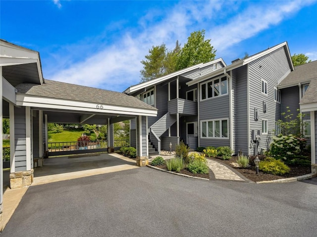 66 Country Club Vlg Unit 66, Lake Toxaway, NC 28747 - view of building exterior featuring stairs and driveway