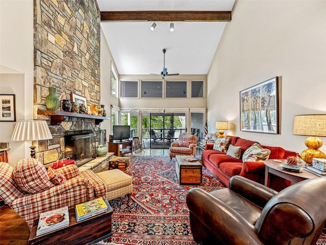 66 Country Club Vlg Unit 66, Lake Toxaway, NC 28747 - living area featuring a towering ceiling, ceiling fan, a stone fireplace, beamed ceiling, and wood finished floors
