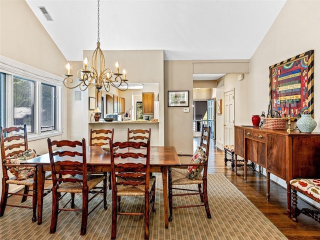 66 Country Club Vlg Unit 66, Lake Toxaway, NC 28747 - dining space with vaulted ceiling, wood finished floors, and a chandelier