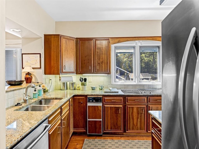 66 Country Club Vlg Unit 66, Lake Toxaway, NC 28747 - kitchen with stainless steel appliances, backsplash, light stone countertops, and dark wood-style floors