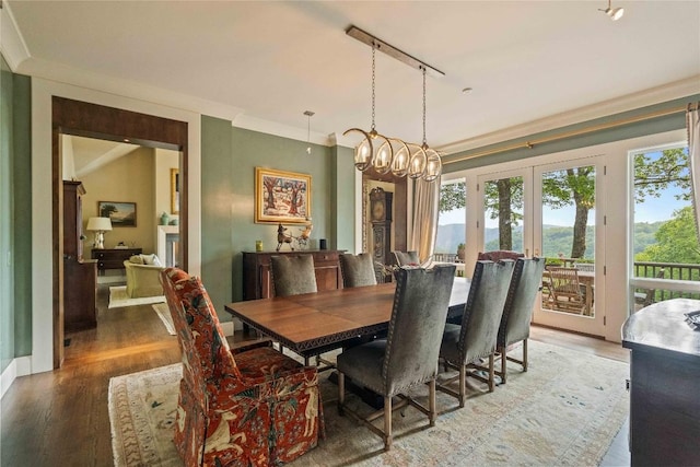 170 Old Hunters Run, Cashiers, NC 28717 - dining area with light wood-type flooring, a chandelier, french doors, crown molding, and track lighting