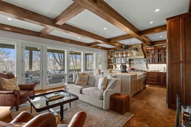 living area featuring beam ceiling, french doors, recessed lighting, and coffered ceiling