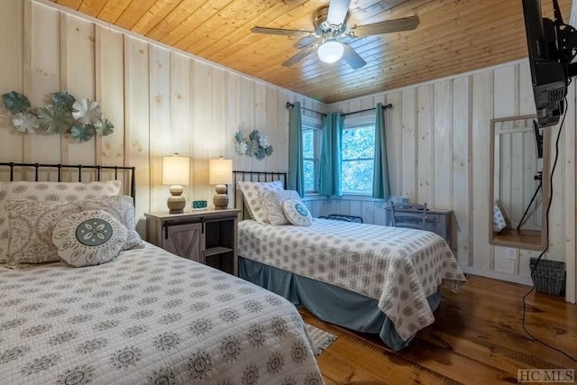 bedroom with hardwood / wood-style flooring, ceiling fan, and wooden ceiling