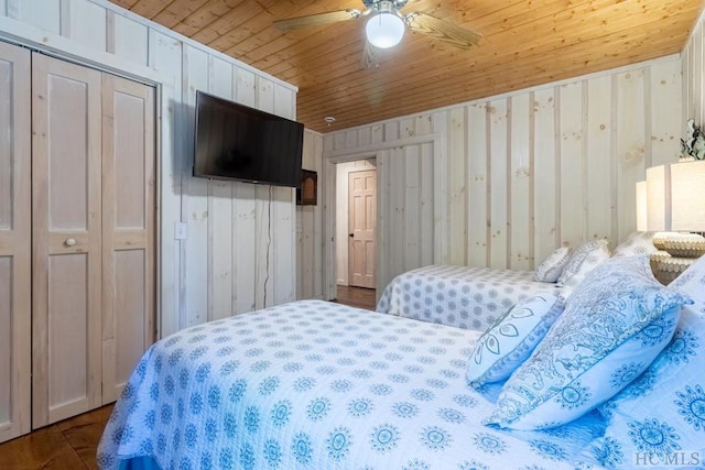 bedroom with ceiling fan and wooden ceiling