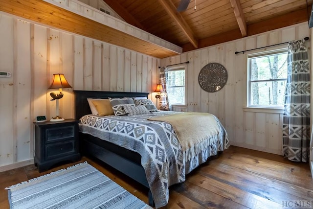 bedroom featuring wood walls, dark hardwood / wood-style floors, wooden ceiling, and lofted ceiling with beams